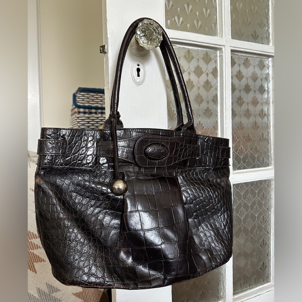 Vintage Furla genuine leather handbag in a dark brown color.